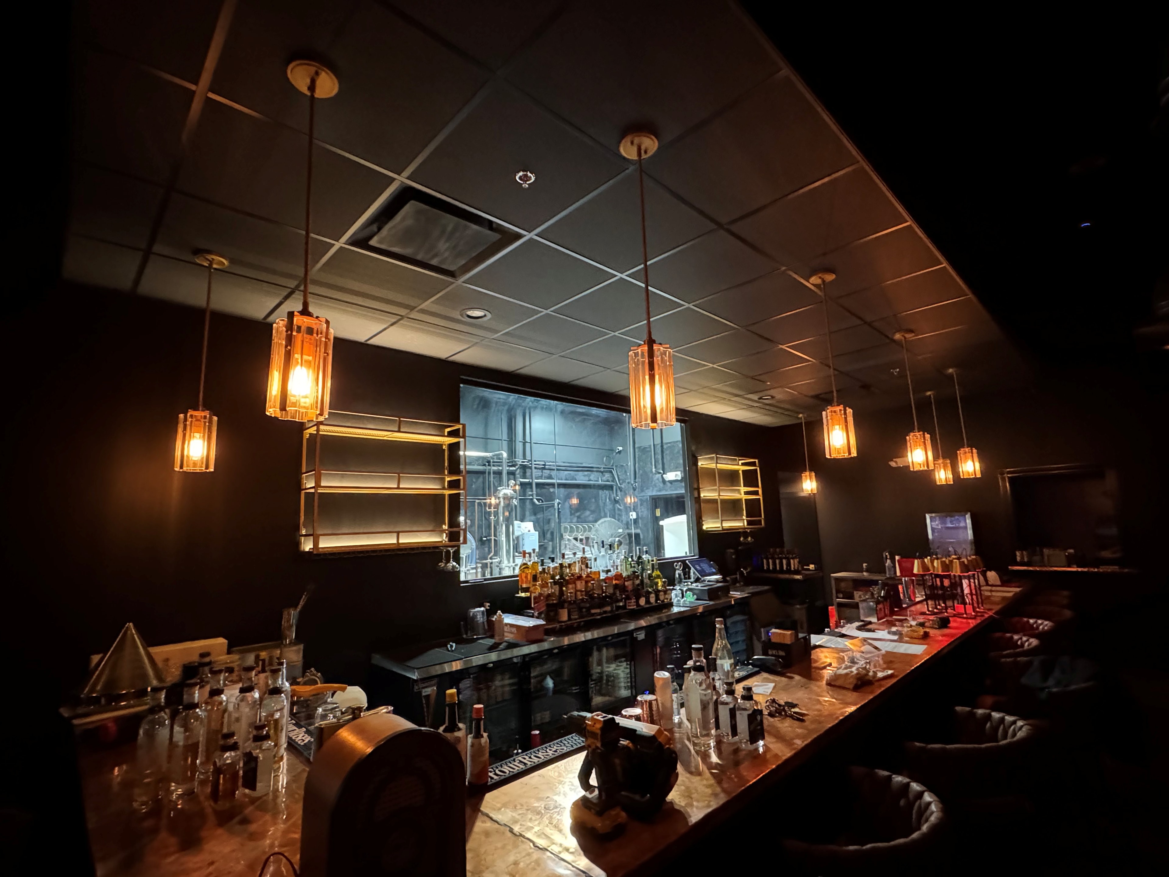 The finished copper-top bar with amber pendant lighting