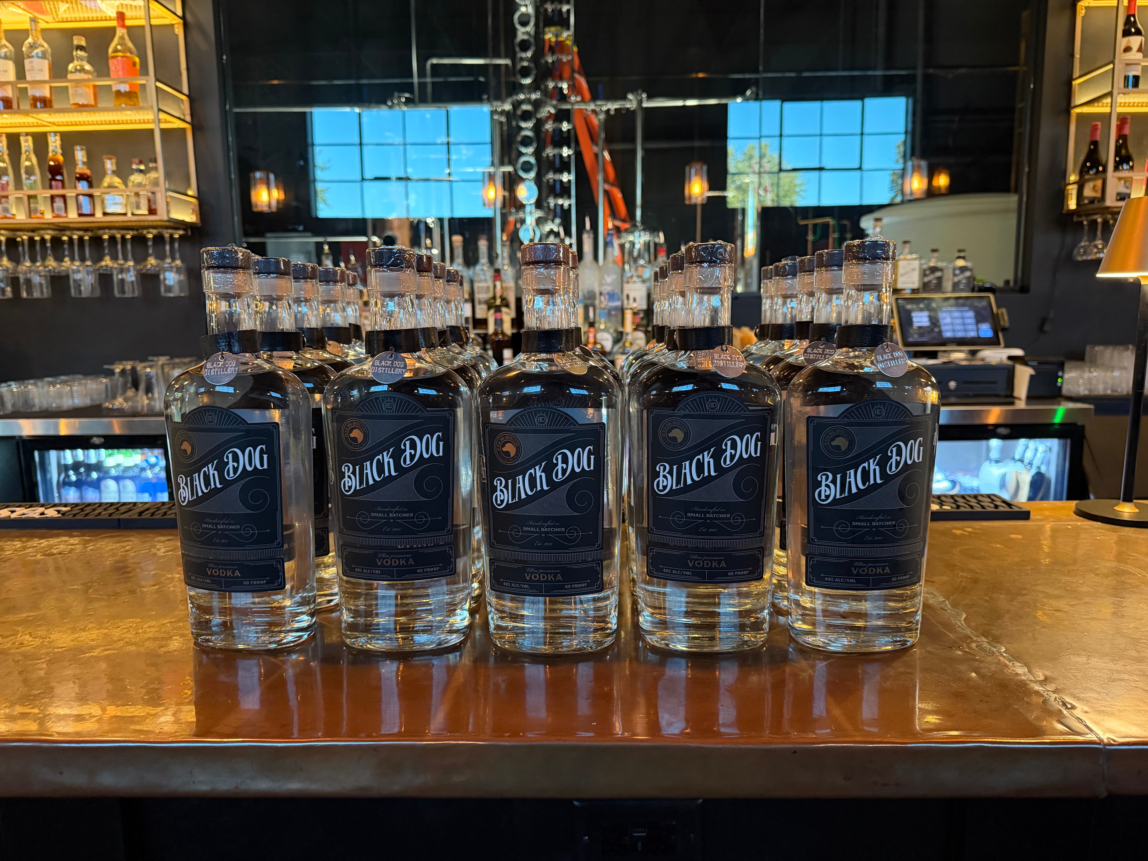 Hand-crafted spirits from Black Dog Distillery lined up on the bar
